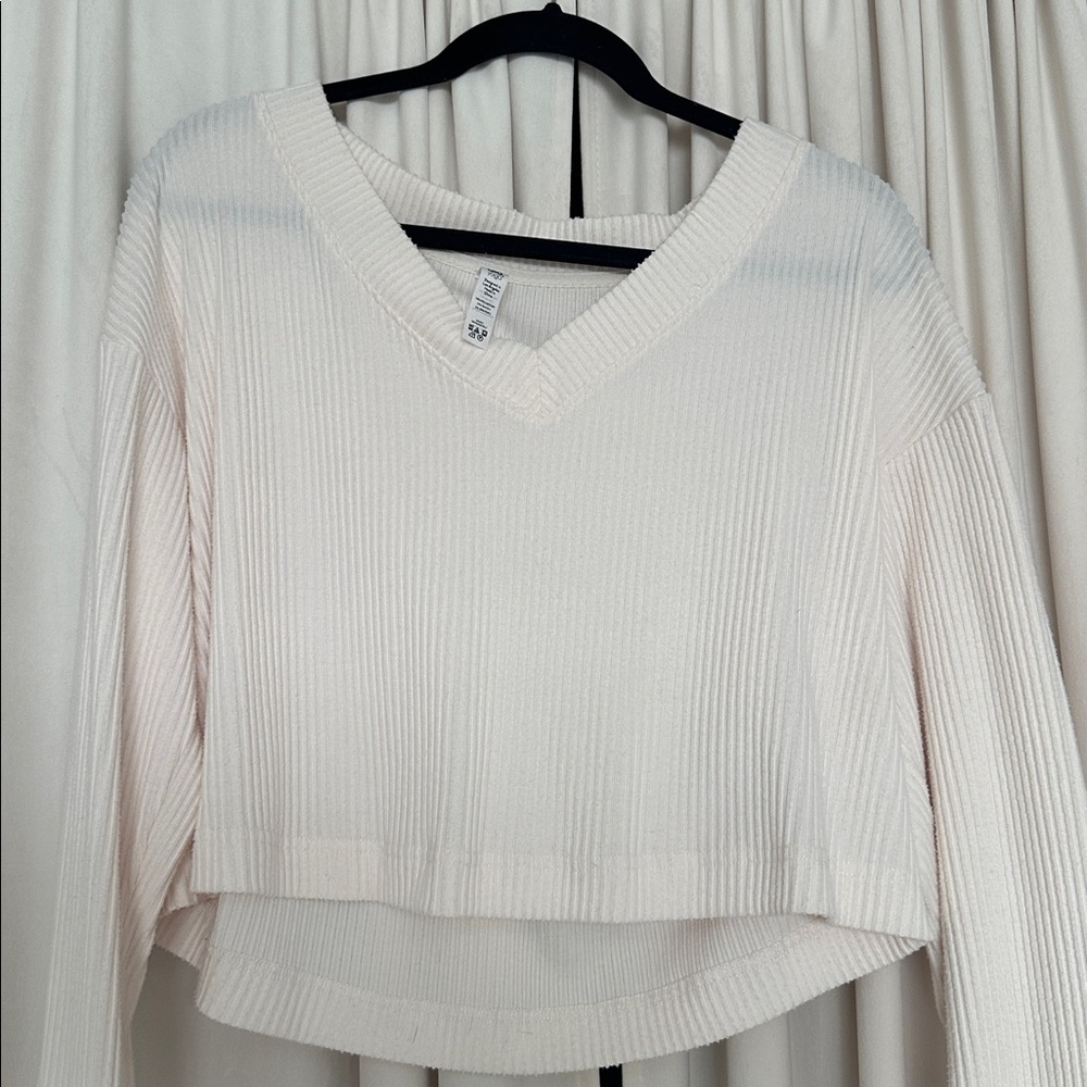 ALO Yoga Ribbed V-Neck Cropped Sweatshirt in Cream - Picture 6 of 7